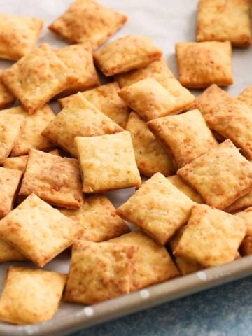 square crackers on a metal baking sheet.