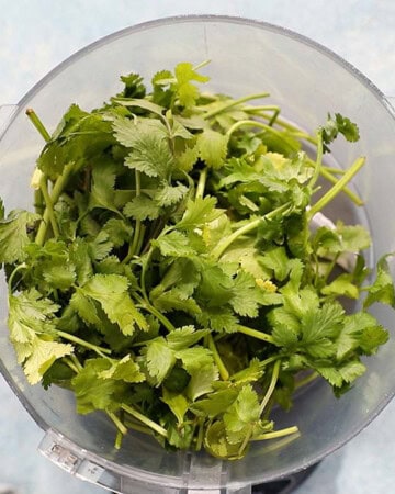 cilantro leaves in a food processor.