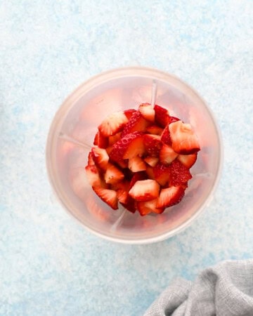 chopped strawberries in a small blender.