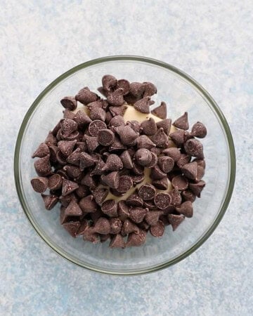 brown chocolate chips placed in a glass bowl.