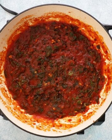 cooked red sauce in a large white skillet.