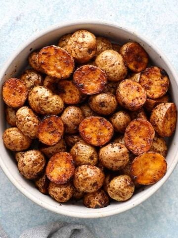 roasted baby potatoes in a white bowl.