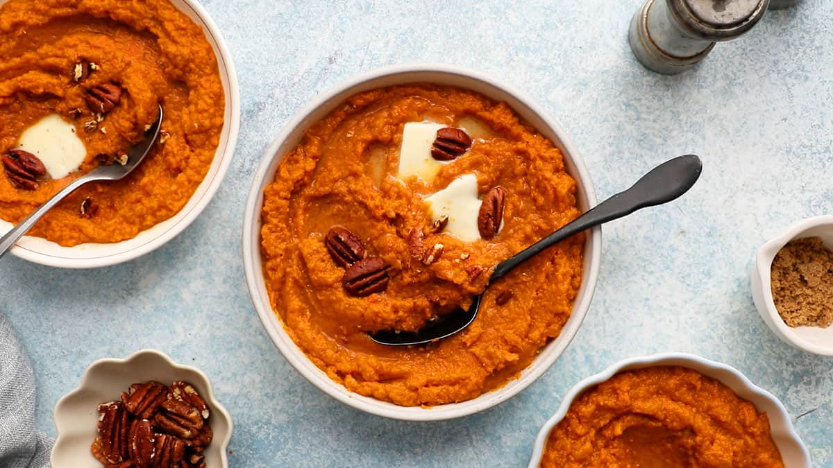 mashed sweet potatoes in a white bowl.