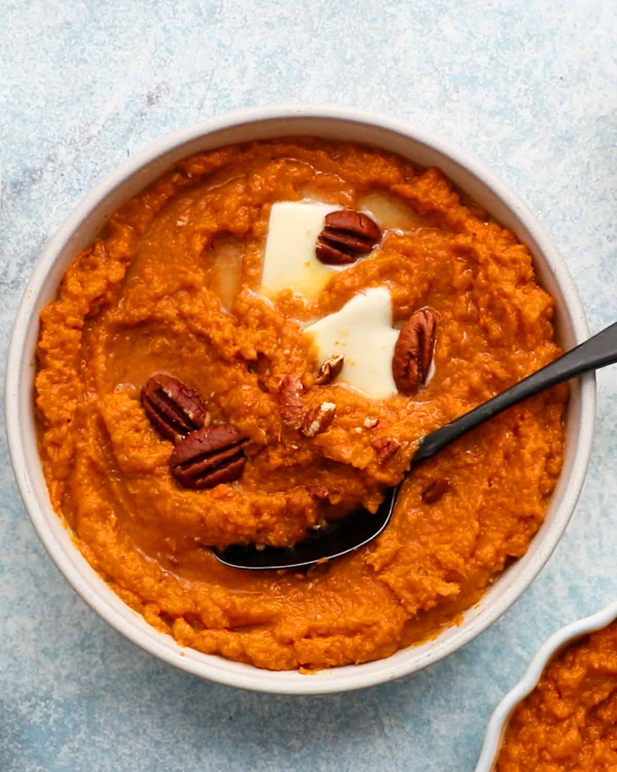 mashed sweet potatoes in a white bowl.