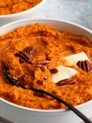 mashed sweet potatoes in a white bowl.